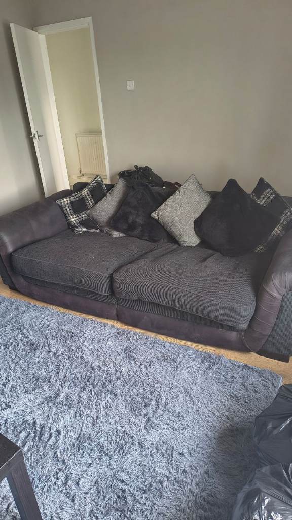 Black and grey 4 seater and armchair