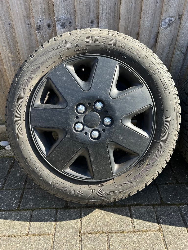 BMW Steel Wheels with Goodyear Ultra grip M&S run flat tires with hubcaps 