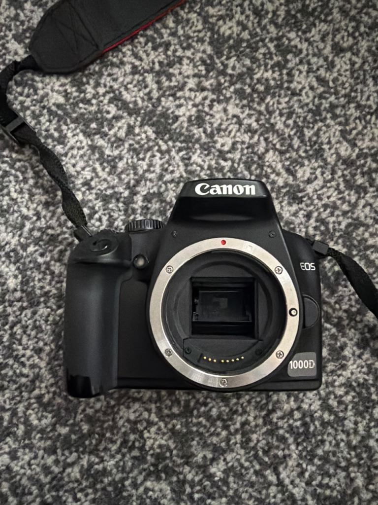 Canon EOS 1000D DSLR Camera Body with Strap – Good Condition