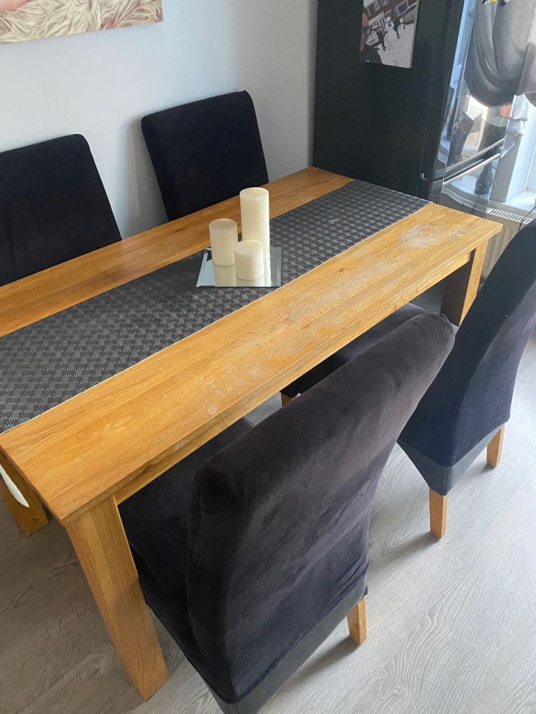 Wooden Dining Table with 4 Black Chairs – Fair Condition