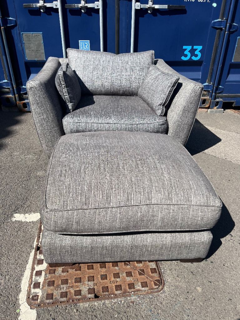 Grey fabric cuddle chair with footstool 