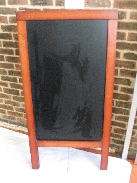 Advertisement Stand ( or pavement stand ).Large, heavy, strong and stable