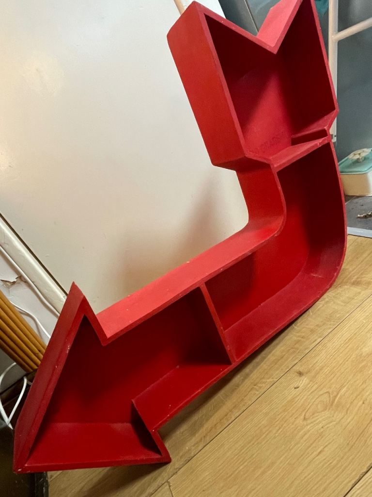 Arrow shaped shelf - red.