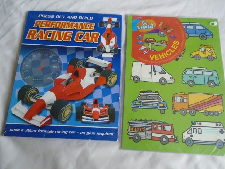 Boys making models books - Press OUt & Build Racing Car,  and cut out Vehicles
