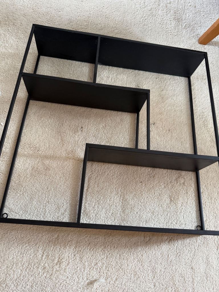 Black metal shelving .  