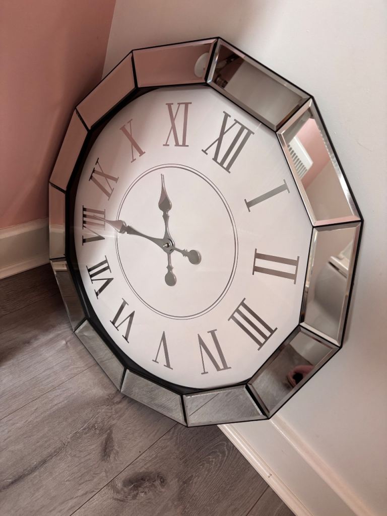 Large mirrored wall clock