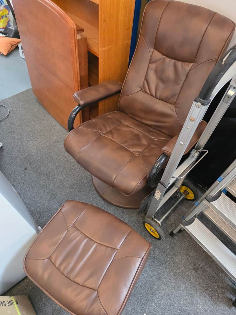 Brown leather armchair and footstool