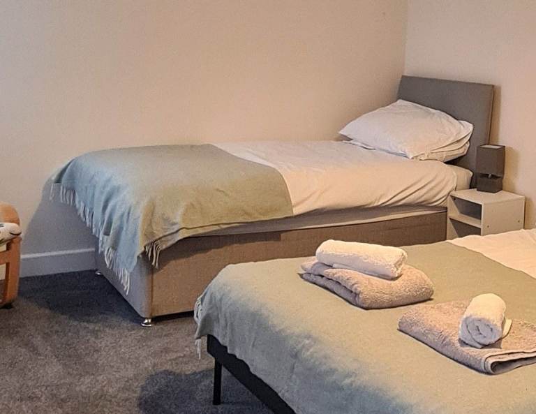 Single grey divan with headboard and mattress