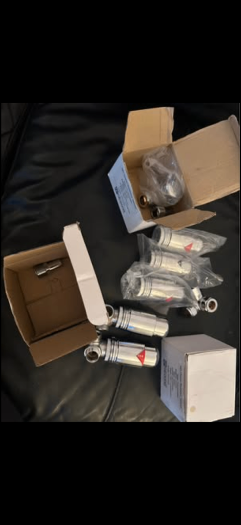 MIX OF CHROME AND WHITE THERMOSTATIC RADIATOR VALVES (TRVs) with 4 Connor valves.