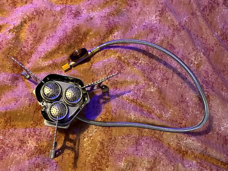 Brand new camping stove cooks food very fast-electric starter-small compact box takes C250-500 cans