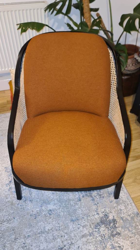 Rust orange armchair with mesh 