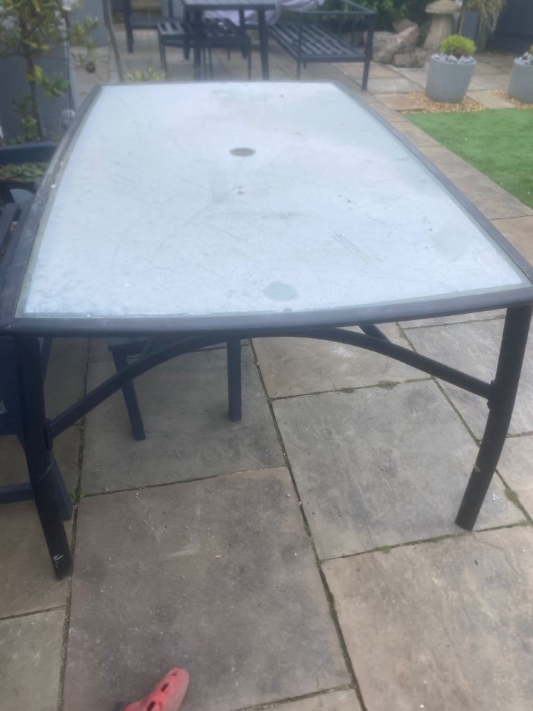 Glass and black garden/patio table