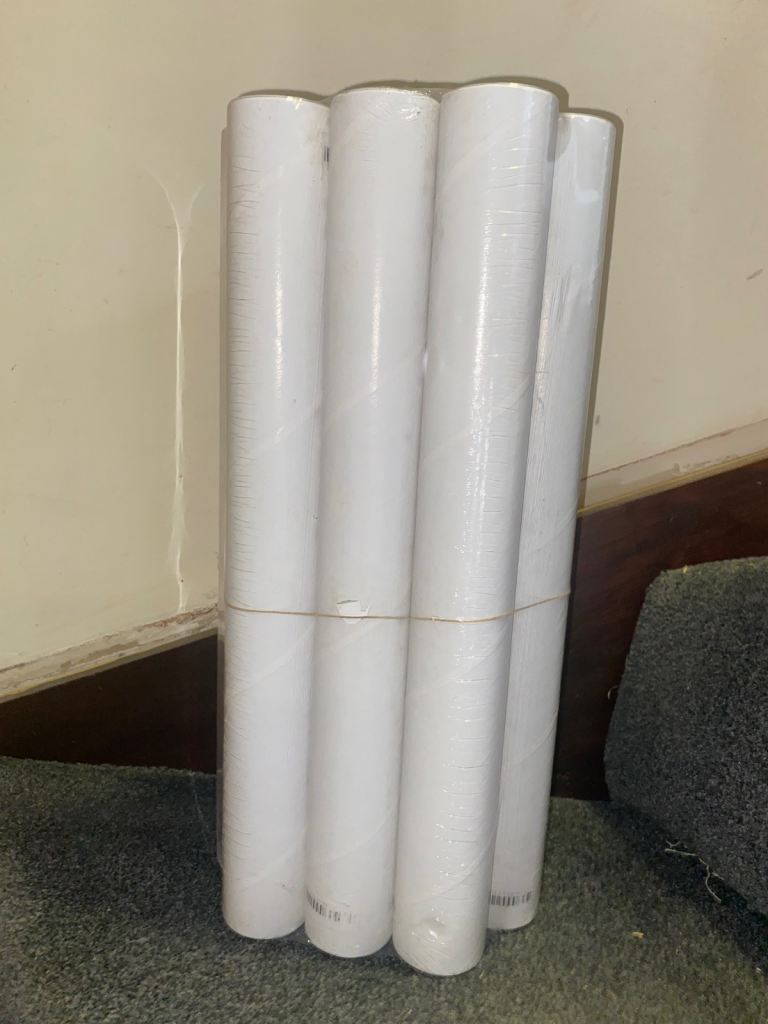 A Bundle of 10 White Cardboard Postal Tubes