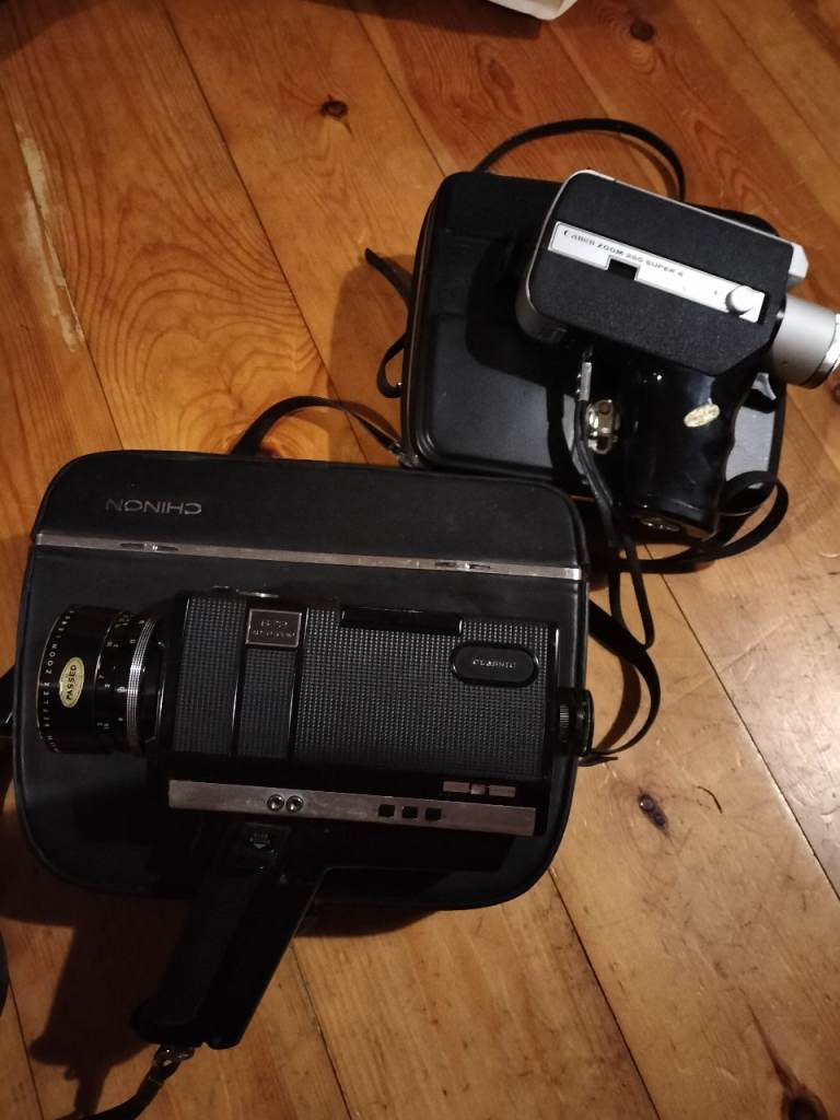 2 vintage cine cameras in cases