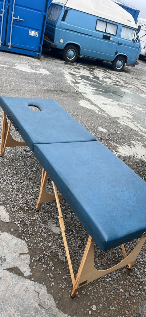 Folding massage table