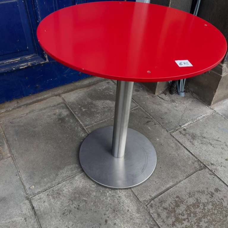 Modern Table , red top , metal base . Sturdy table .  