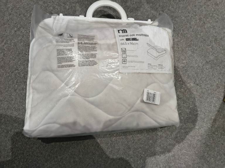 Travel cot mattress and waterproof sheet.