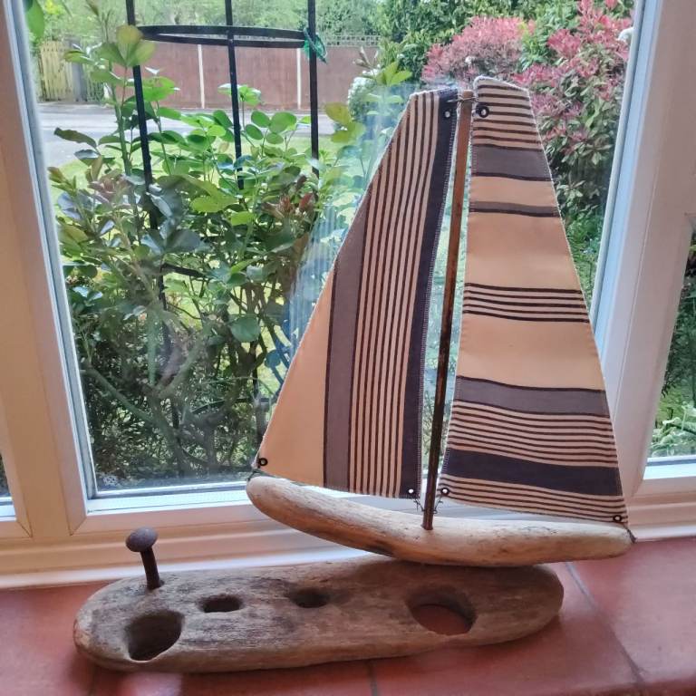Handcrafted driftwood sailboat art piece