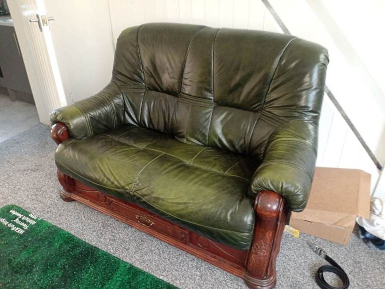 Antique green leather sofa with drawer