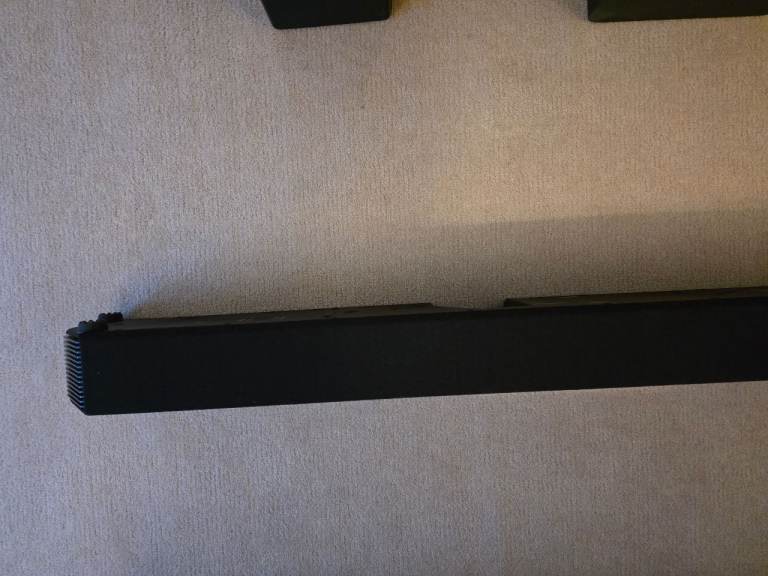 Samsung HW-Q950A soundbar with rear speakers and subwoofer