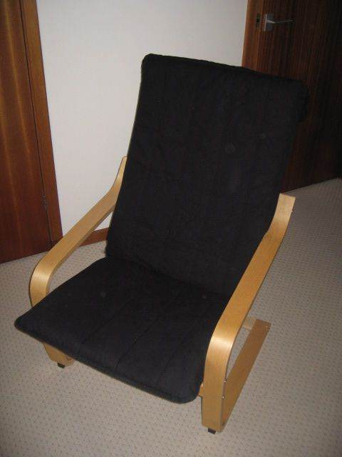 2 - Ikea reclining chairs, 1 black, 1 cream 
