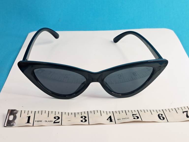 black cat-eye sunglasses are similar in style to the "Clout Goggles" retro mod fashion sunglasses. 