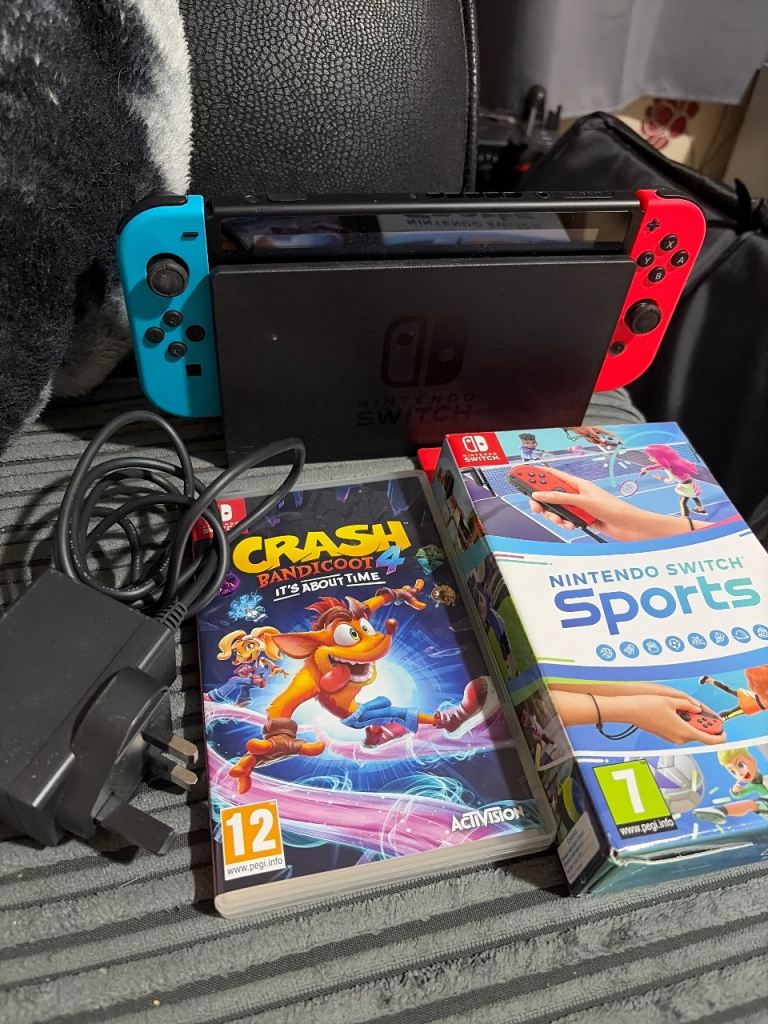 Nintendo Switch Console with Games and Charger – Good Condition