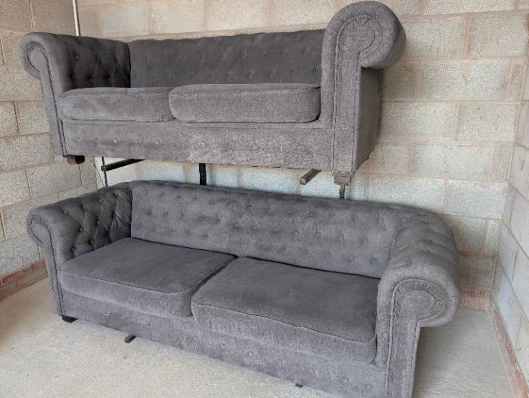 Grey chesterfield style sofas 