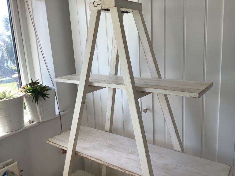 Distressed white wooden shelving unit. Easy to put up and dismantle. Solid wood.
