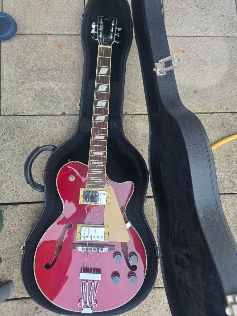 AXL Hollow body electric guitar with good hard case. 