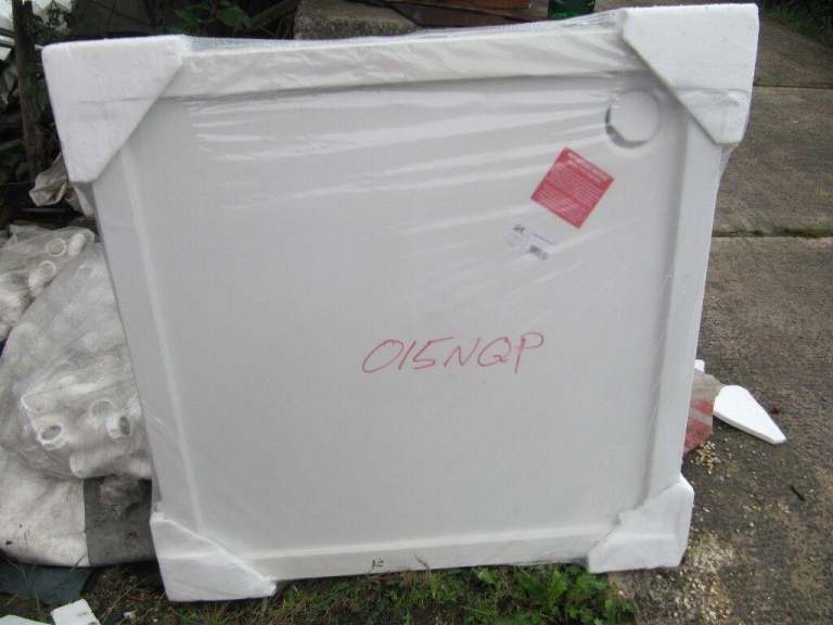 1 x white shower tray still in wrappings size 1000x1000. 90mm outlet