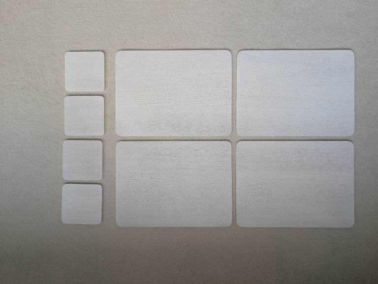 Set of 4 John Lewis white wooden placemats and coasters