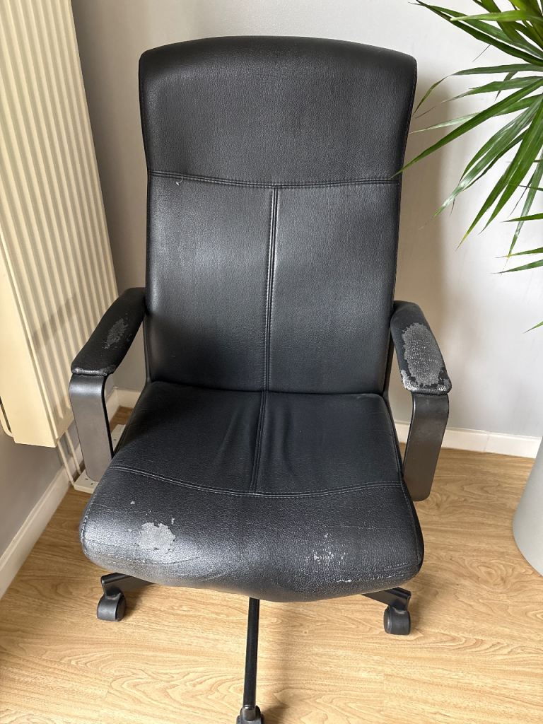 Office chair with covering coming off in placed  