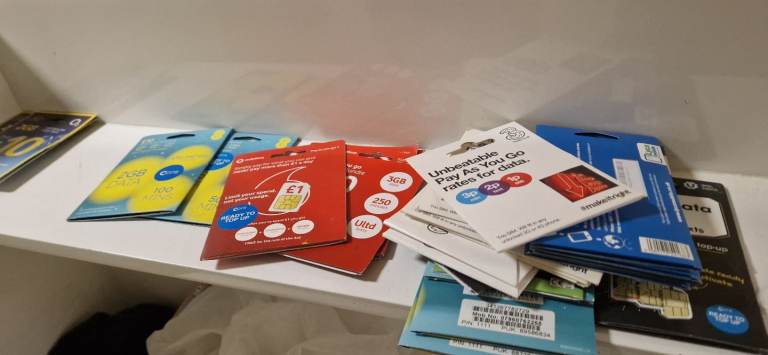 JOB LOT of Mobile phone cases glass projectors & paug sim cards 