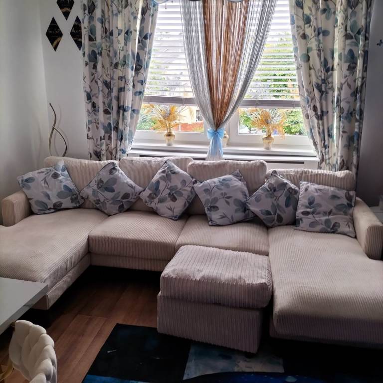 Comfy Beige Corner Sofa with Footstool – Good Condition