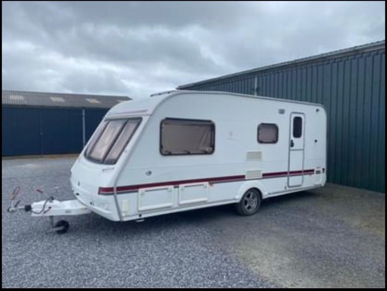 Swift 565 caravan with large awning 