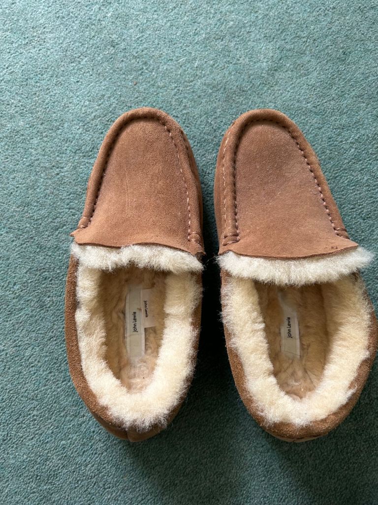 Pair of suede slippers with sheepskin lining.