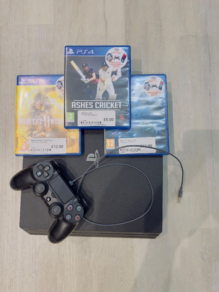 Sony PlayStation 4 Pro Console with Controller and Games