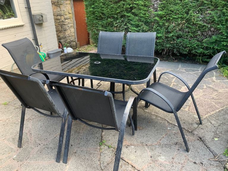 Outdoor Black glass top Table and 6 chairs