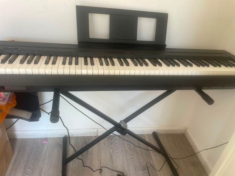 Yamaha Electric Keyboard with Stand – Good Condition
