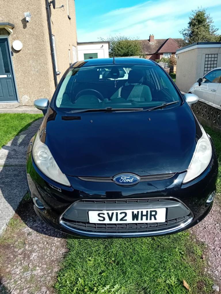 2012 Ford Fiesta 1.2 petrol, very reliable and economical.