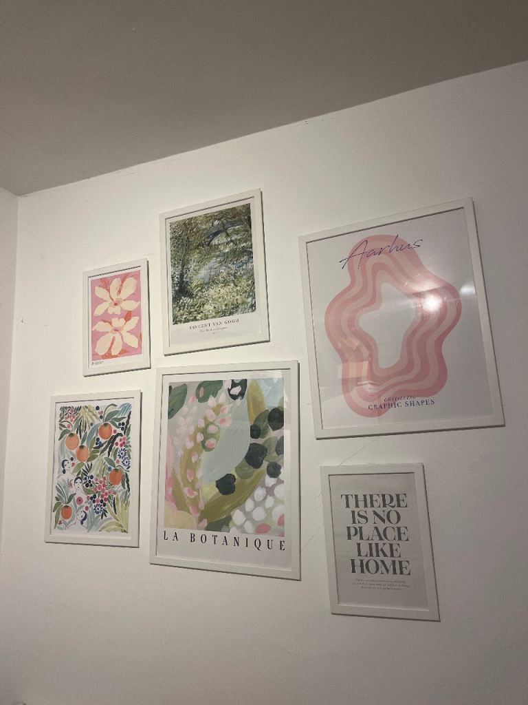 6 mismatched frames green and pink wall art 