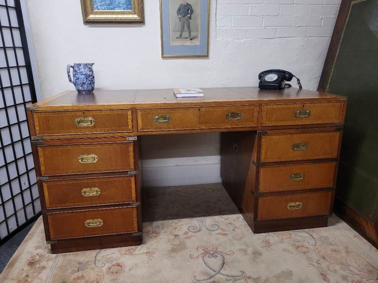 Large vintage double pedestal campaign desk with brown leather inlay and brass detailing