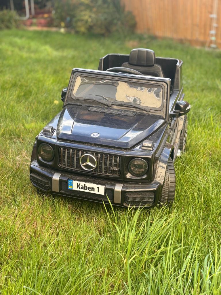 Kids sit in electric car 