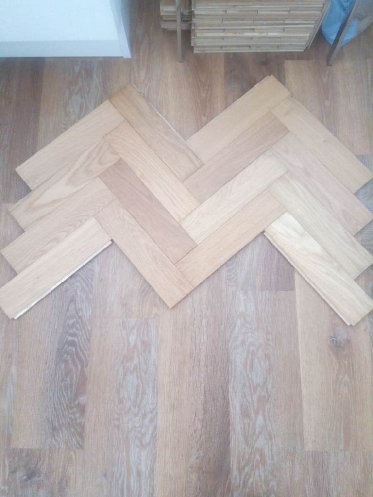 Herringbone pattern wood flooring tiles