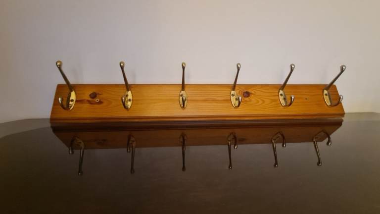 Wooden and metal coat hanger