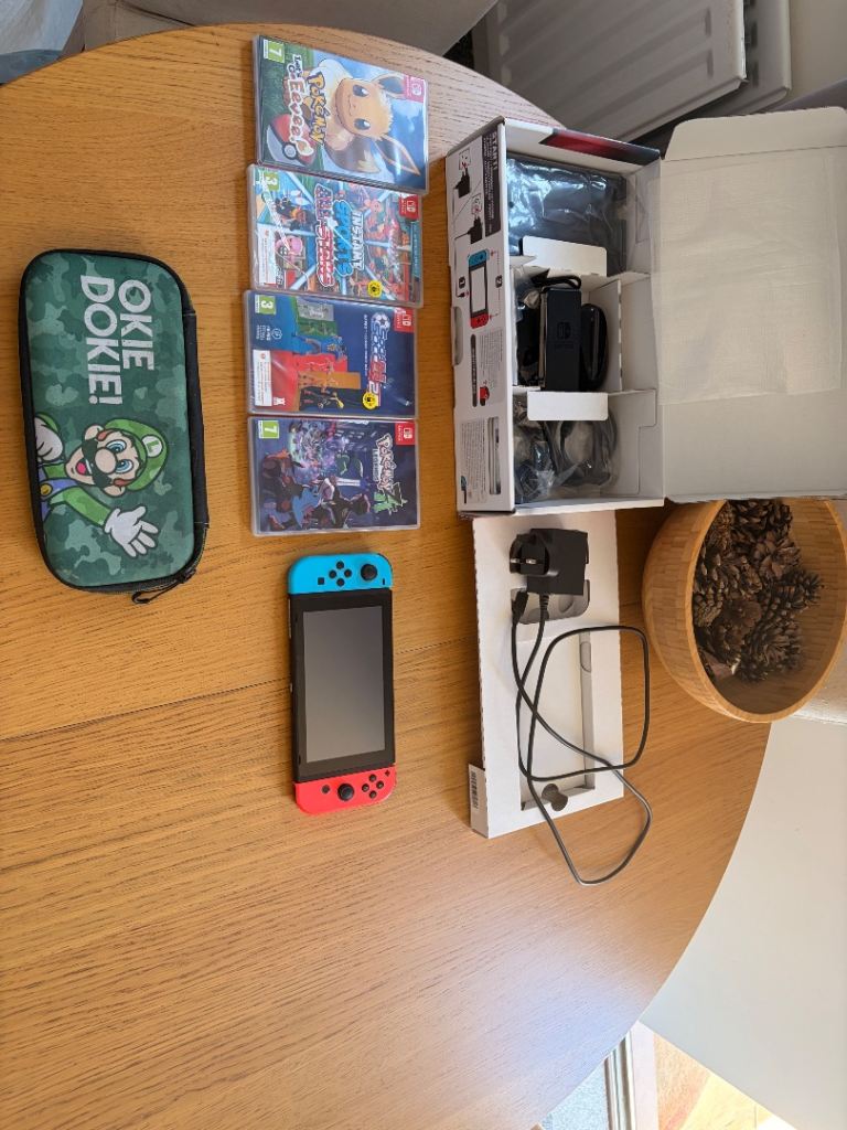 Nintendo Switch Console with Games and Case - Good Condition
