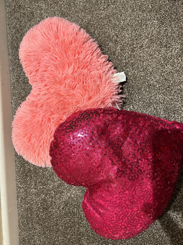 2 heart shaped pillows 
