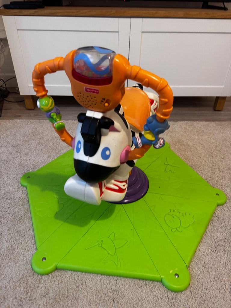 Fisher-Price Bounce and Spin Zebra Ride-On Toy