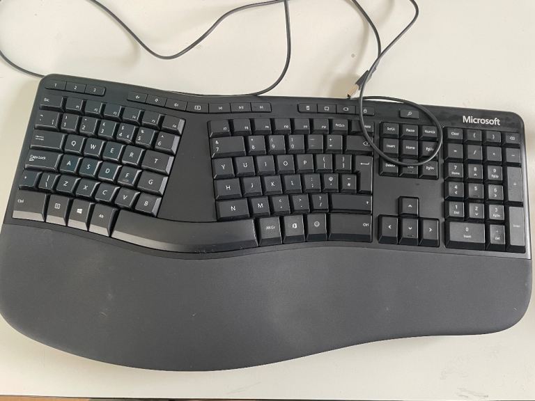 Microsoft ergonomic keyboard with removable stand and Delux ergonomic vertical mouse-right handed. 